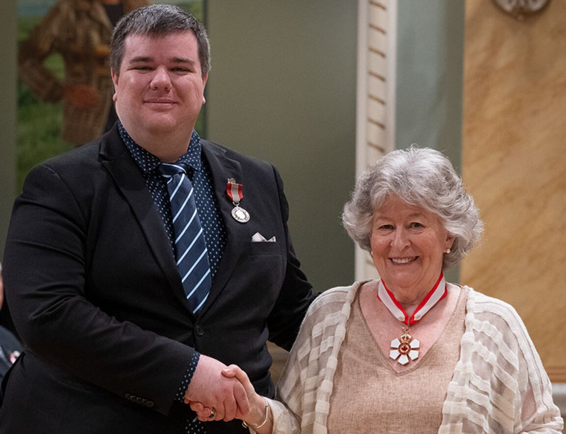 Jason Rivest shakes hands with Canada's Governor General, Louise Arbour, during an official ceremony at Rideau Hall.