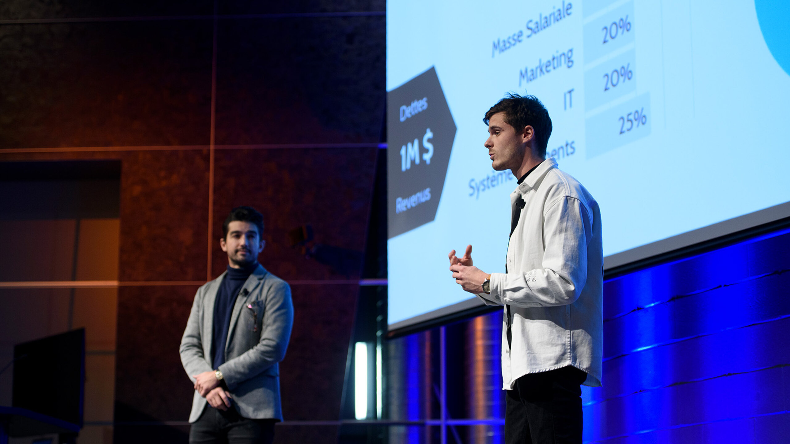 Two entrepreneurs present their project at the Entreprism incubator's demoday.