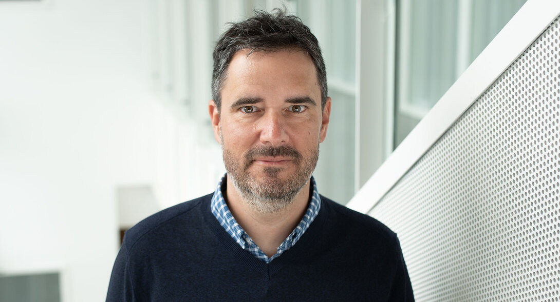 Portrait of Professor Benoit Dostie photographed inside HEC Montréal.
