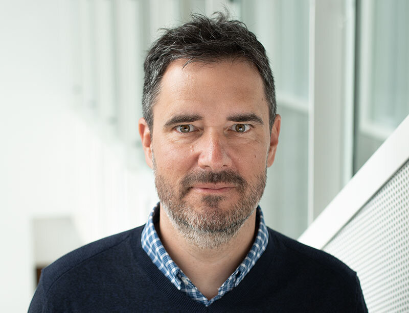 Portrait of Professor Benoit Dostie photographed inside HEC Montréal.