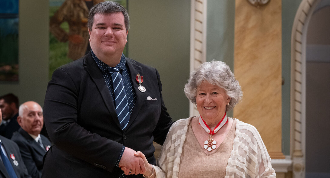 Jason Rivest shakes hands with Canada's Governor General, Louise Arbour, during an official ceremony at Rideau Hall.