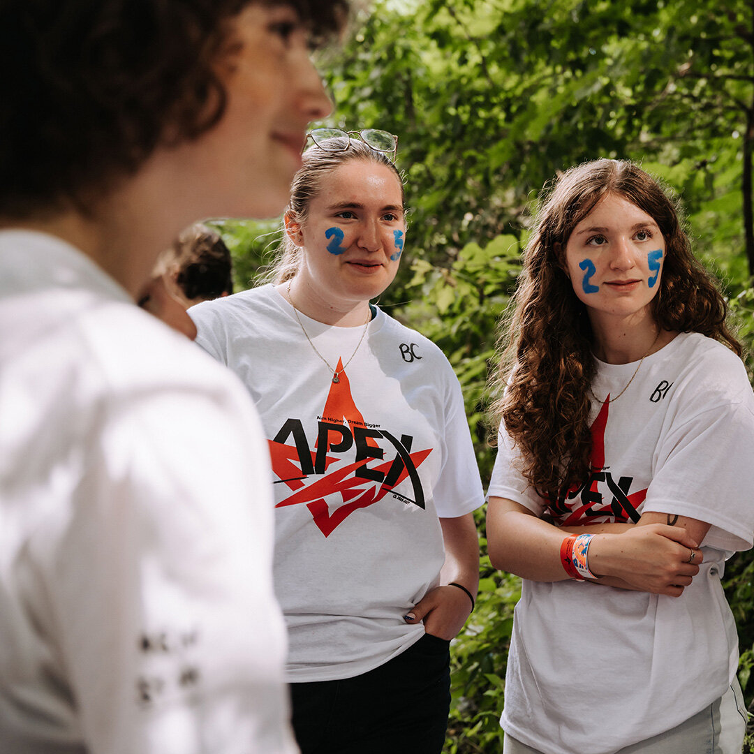 Three female students participating in an outdoor activity on campus as part of the 2026 back-to-school season.